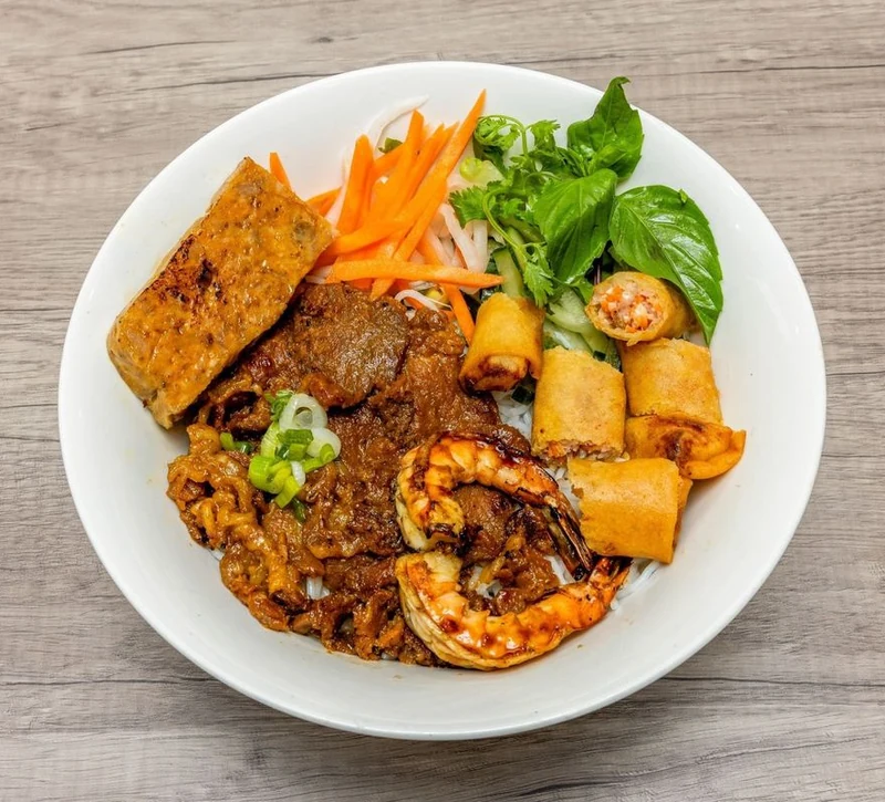 Special Vermicelli with grilled pork, shrimp, spring rolls and pork meatballs at Bep & Brew in Airdrie, AB