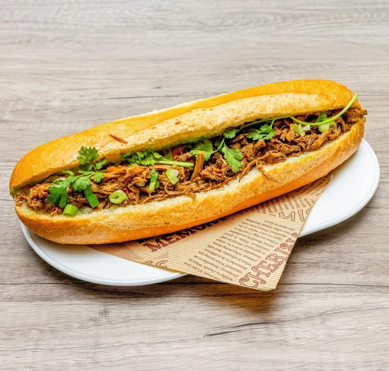 Beef Satay Sandwich banh mi on a crispy baguette at Bep & Brew in Airdrie, AB