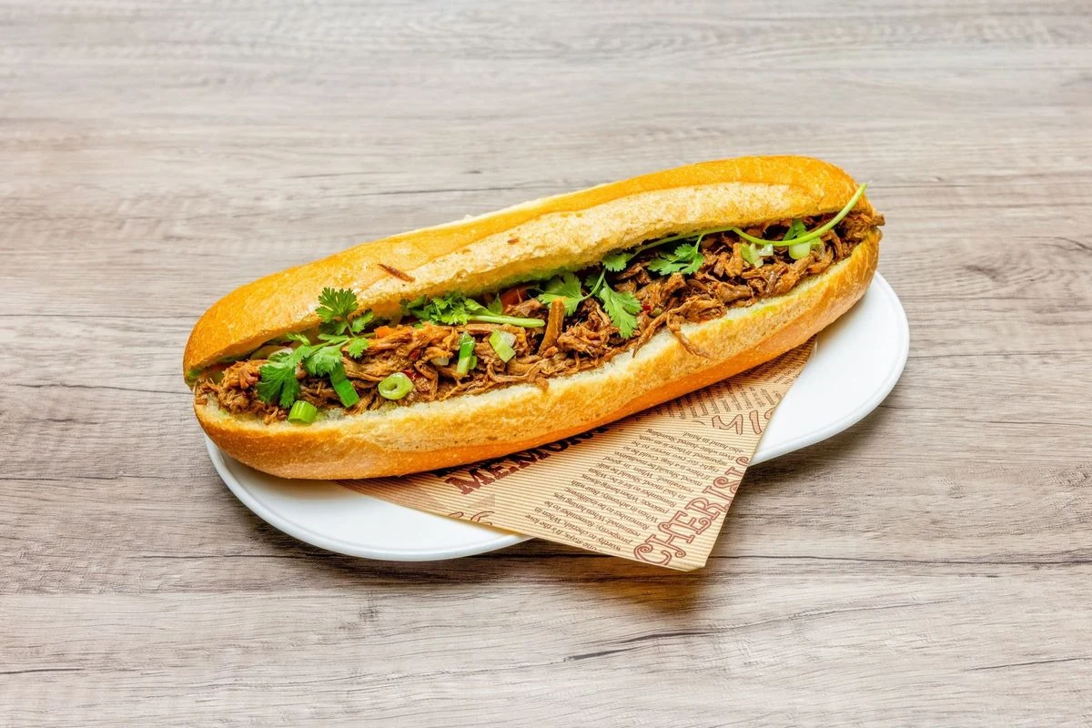 Beef Satay Sandwich banh mi on a crispy baguette at Bep & Brew in Airdrie, AB